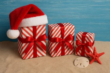 Festive Christmas gifts with summer decorations and wrapping for Christmas in July celebrations