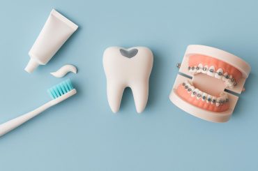 Dental chair, exam tools, and dental X-ray illustrating common family dentist treatments