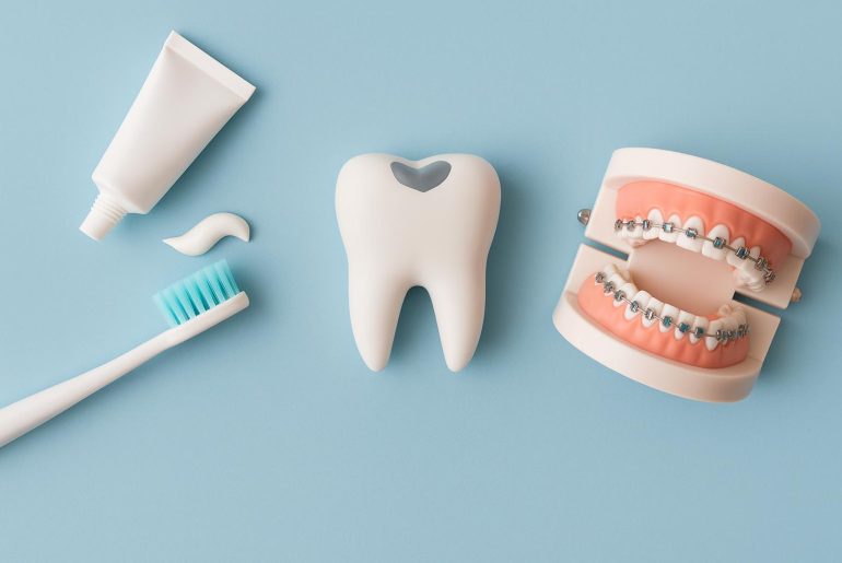Dental chair, exam tools, and dental X-ray illustrating common family dentist treatments