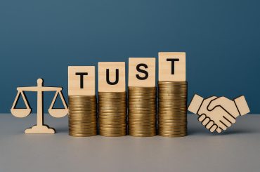 Accounting firm professionals collaborating to establish trust with stakeholders in a modern office
